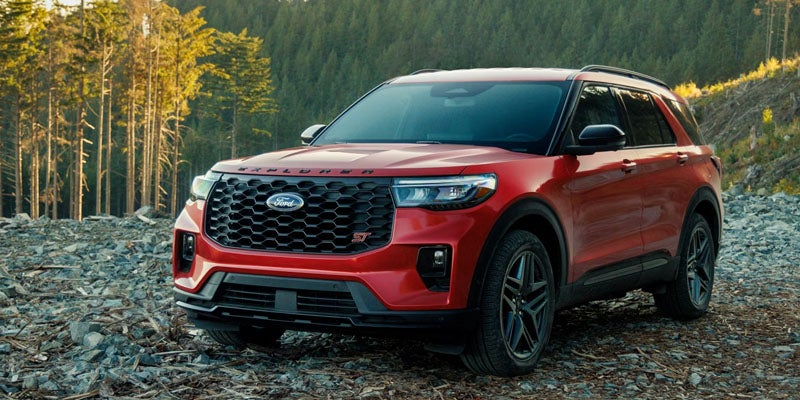 Red Ford Explorer ST SUV parked on rocky terrain